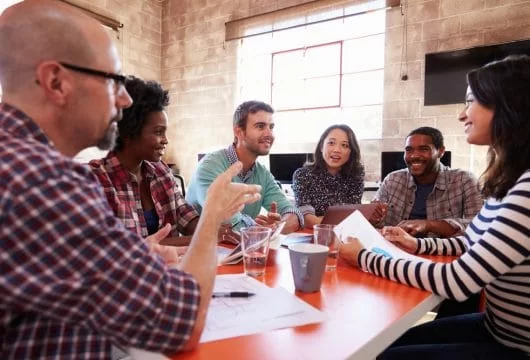 Six-person group meeting to discuss a project