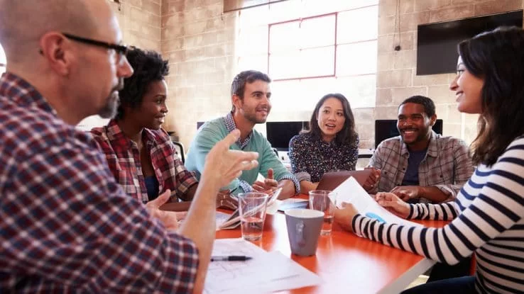 Six-person group meeting to discuss a project