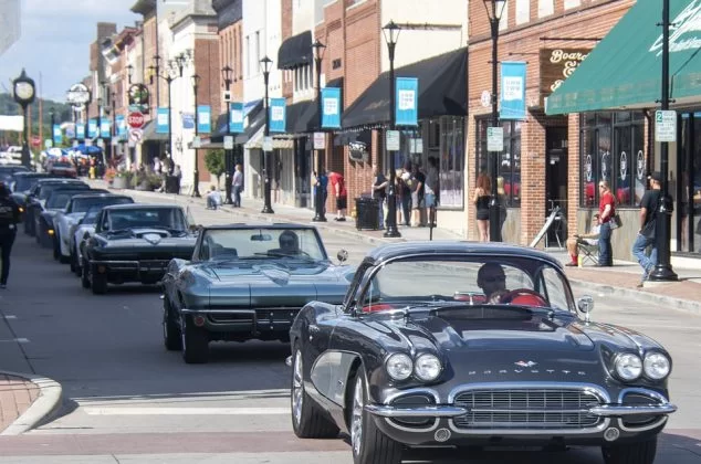 Car club driving through a city