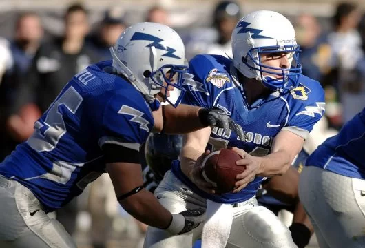 Football players in the middle of a game