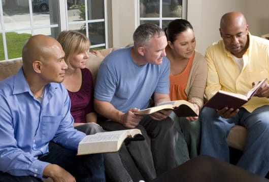 Church group for adults meeting to discuss scripture