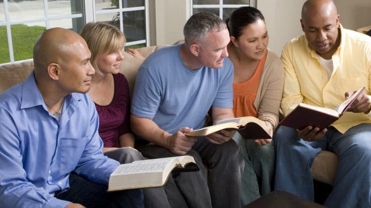 Church group for adults meeting to discuss scripture