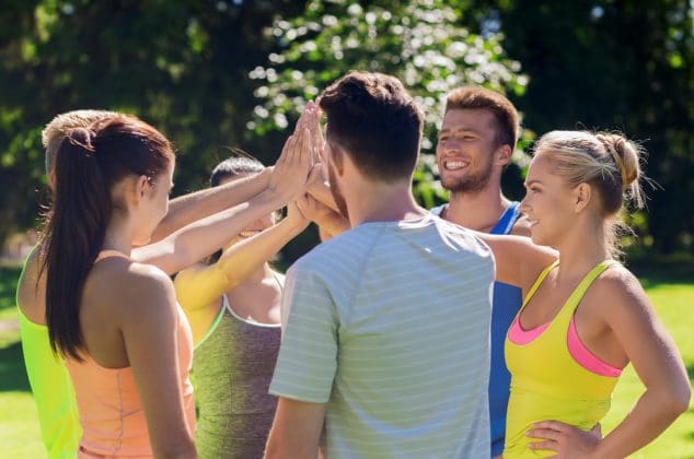 Fitness group meeting at a park to exercise