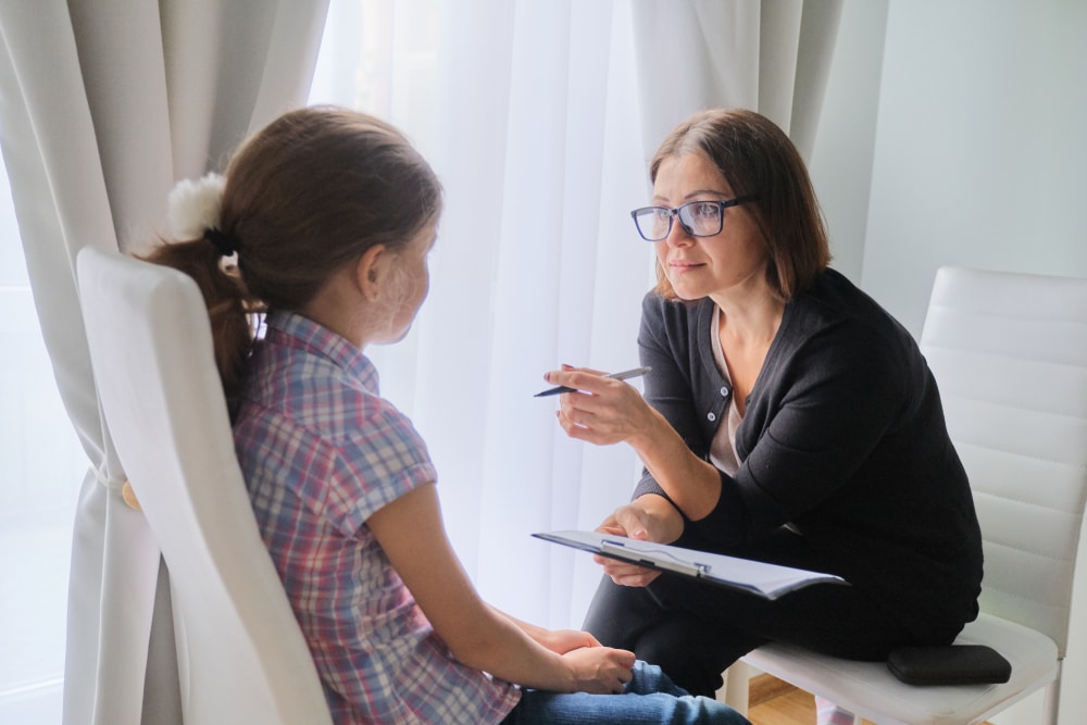 Social worker speaking with a child