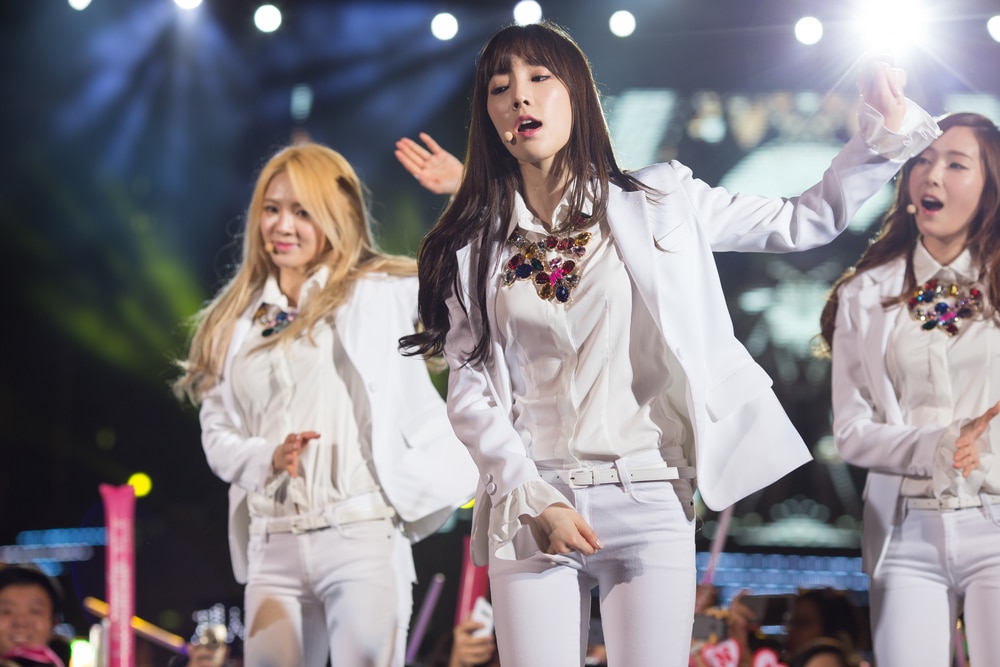 K-pop girl group performing on stage