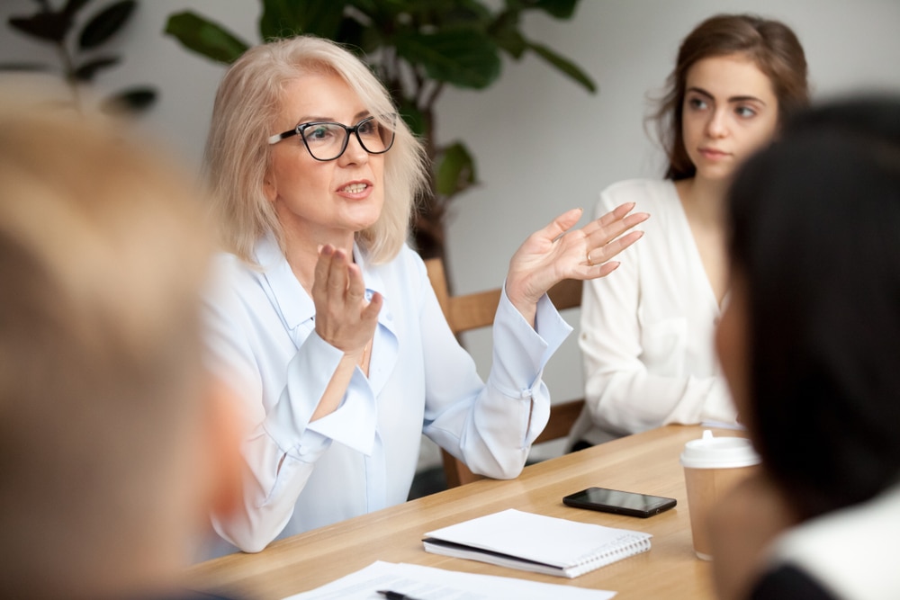 Middle-aged woman leading a mentor group