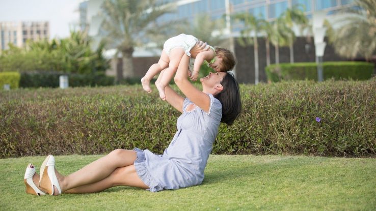 Mom and daughter playing at park