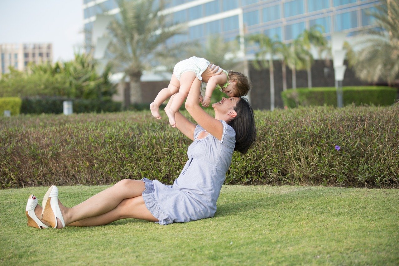 Mom and daughter playing at park