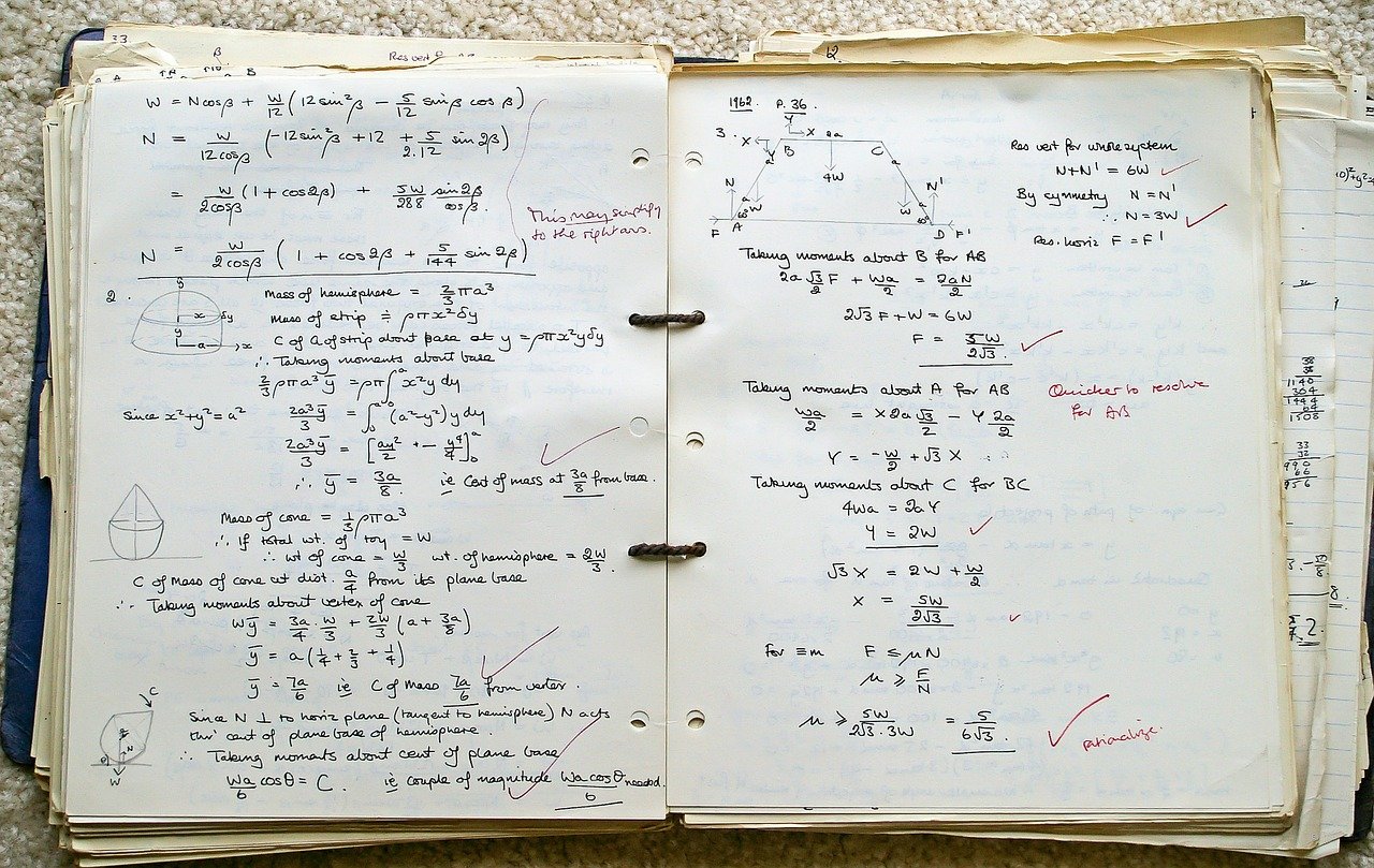 Open notebook with written math practice inside