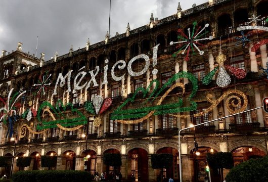 "Mexico!" decorations on a building in Mexico City
