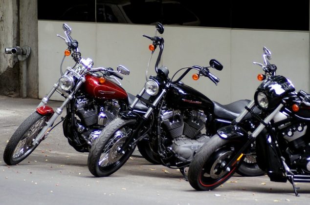 Three motorcycles parked in a row