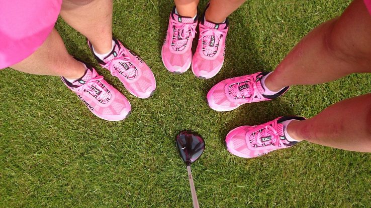 Pink team wearing matching sneakers