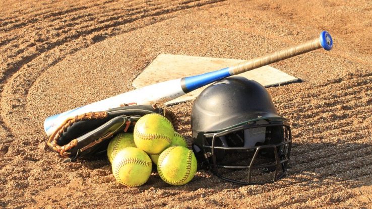 Softball helmet, bat, and balls