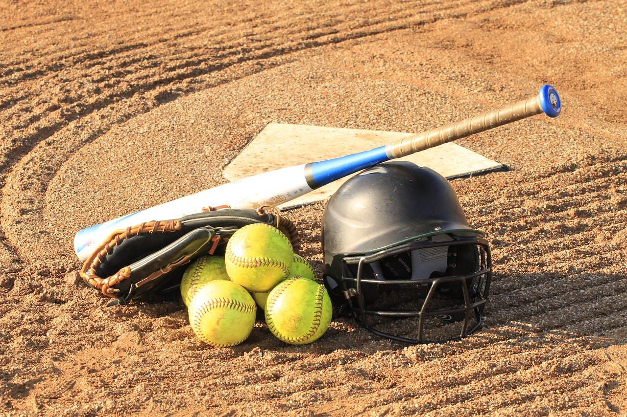 Softball helmet, bat, and balls