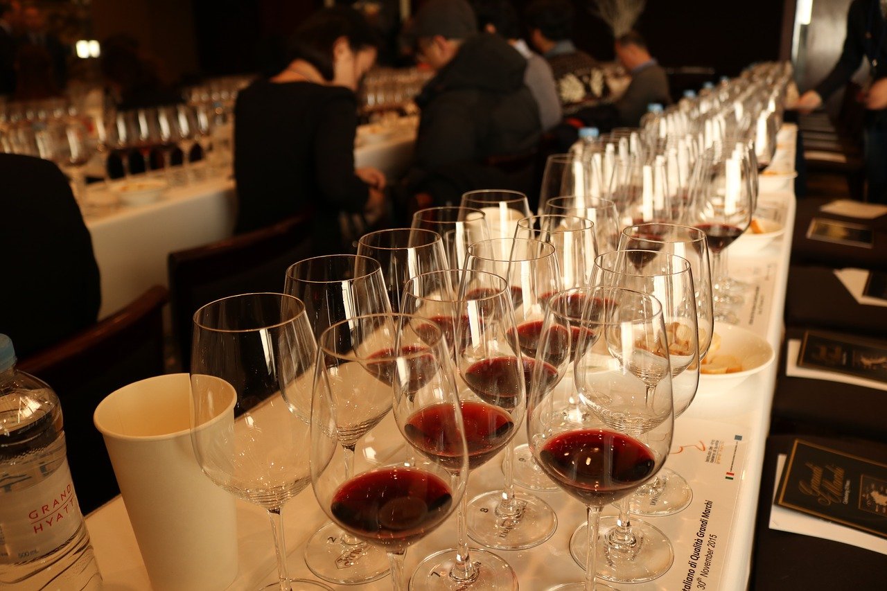 Wine glasses lined up on a table for a wine tasting