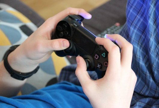 Person holding a video game controller