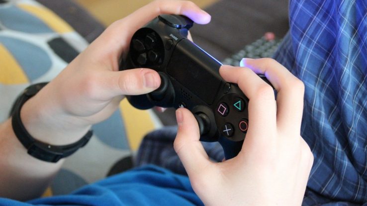 Person holding a video game controller