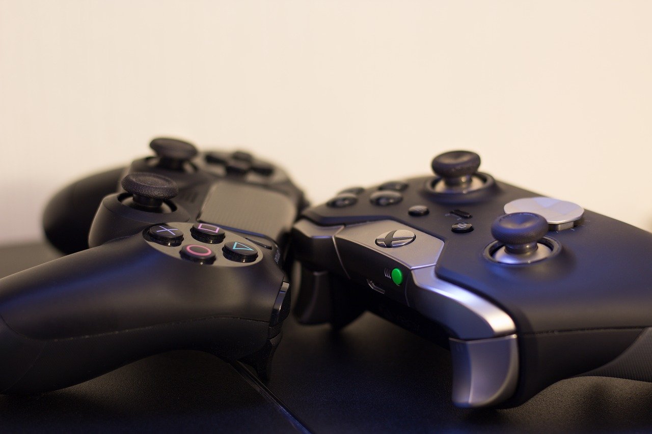 Two video game controllers resting on a table