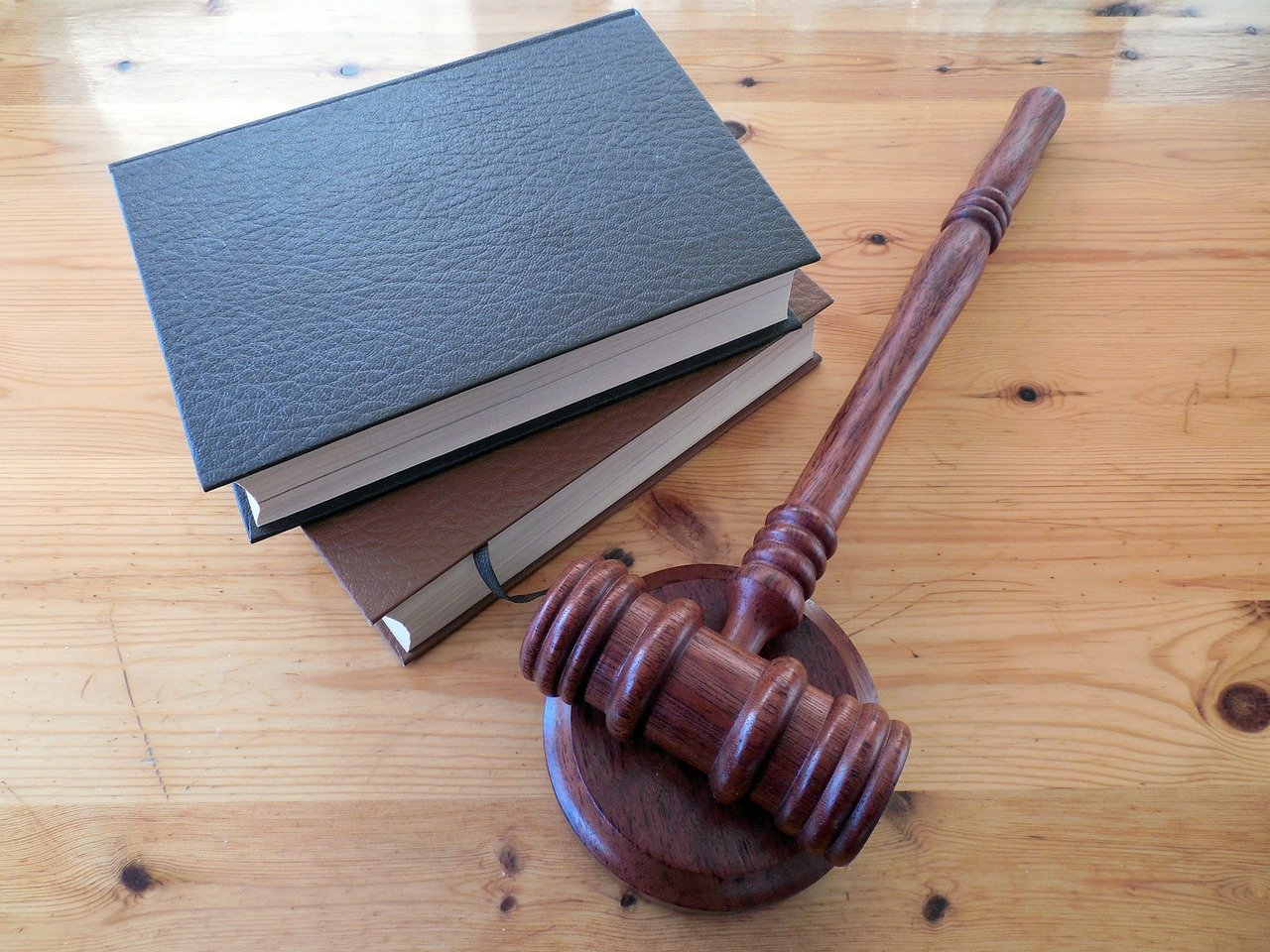 Gavel and legal books resting on table