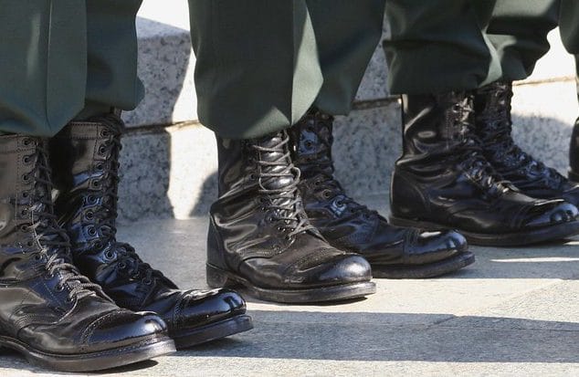 Military boots worn by servicemembers standing in a line