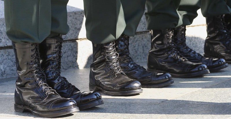 Military boots worn by servicemembers standing in a line