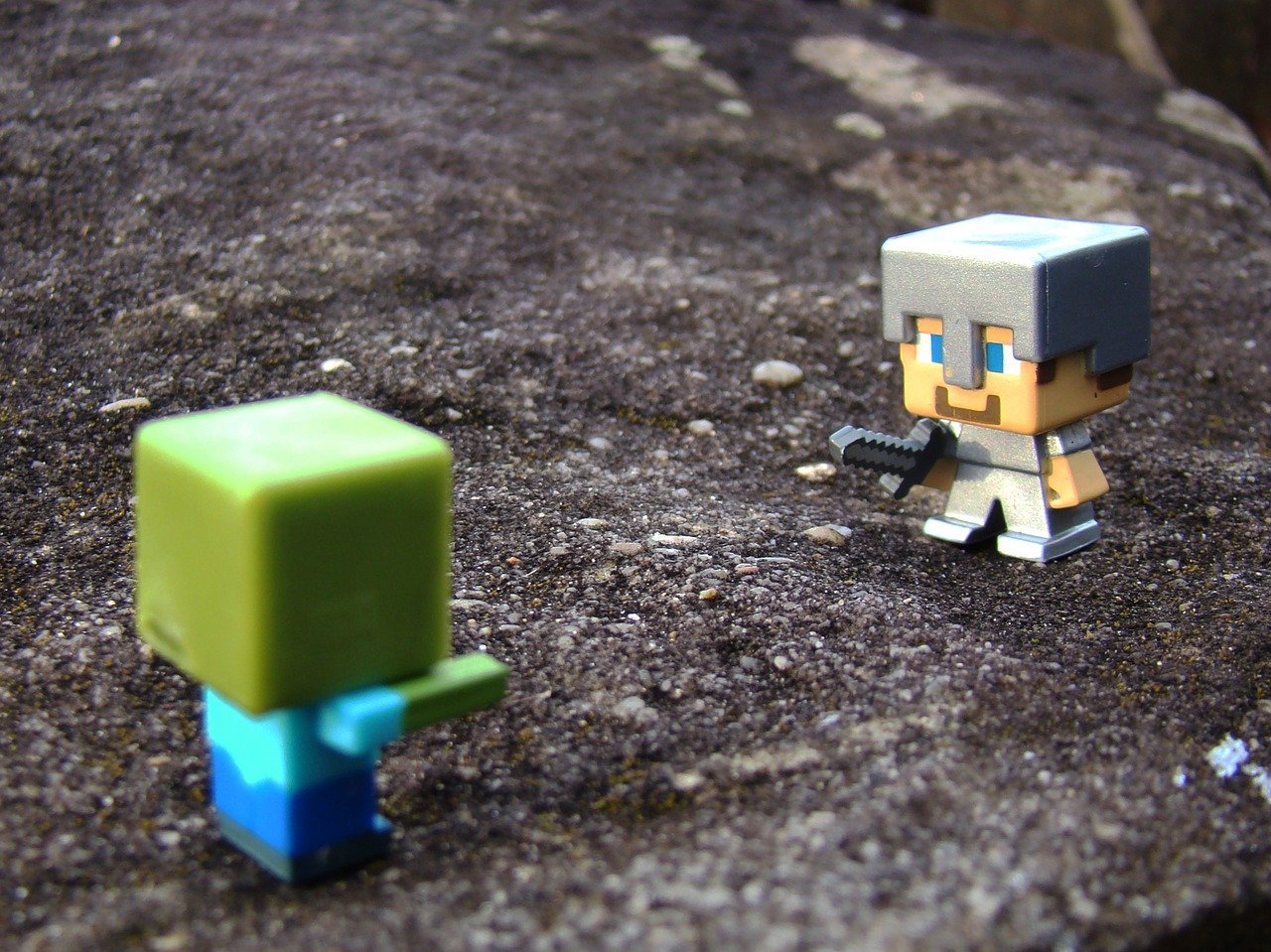 Minecraft toys posed in the dirt