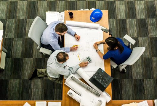 Project team working at a large table
