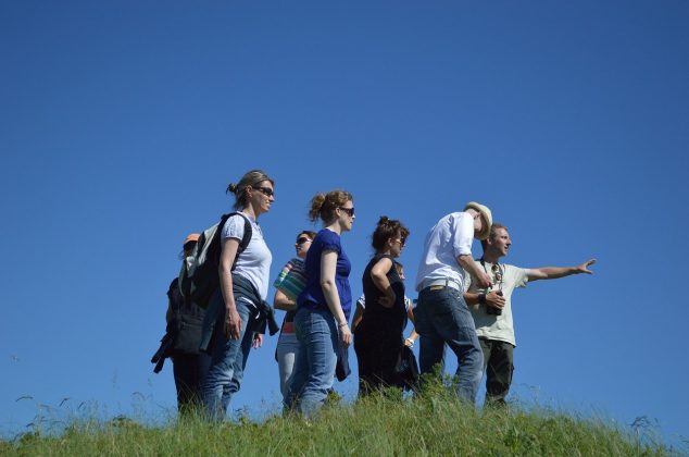 Walking team at the top of a hill