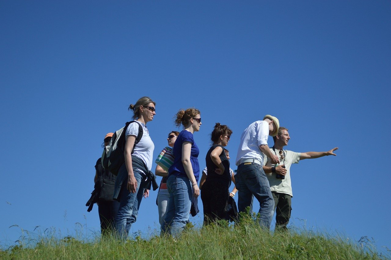 Walking team at the top of a hill