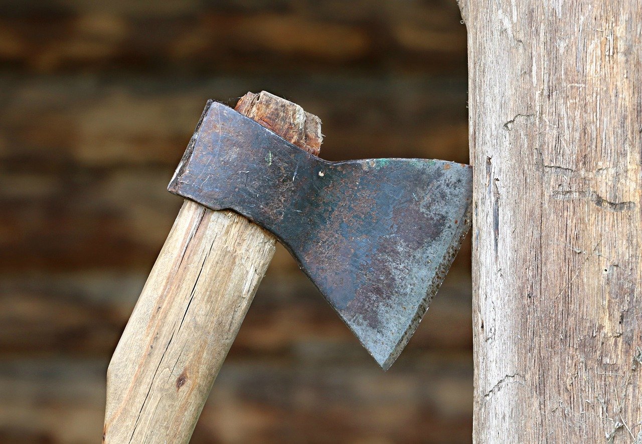 Thrown axe stuck in a piece of wood