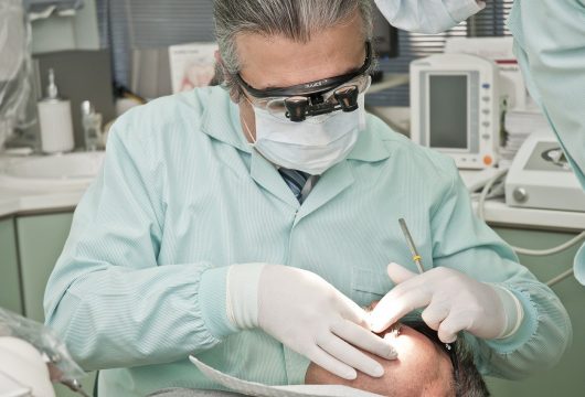 Dentist doing a procedure on a patient