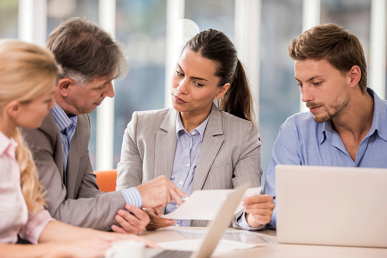 Investment group employees at a meeting