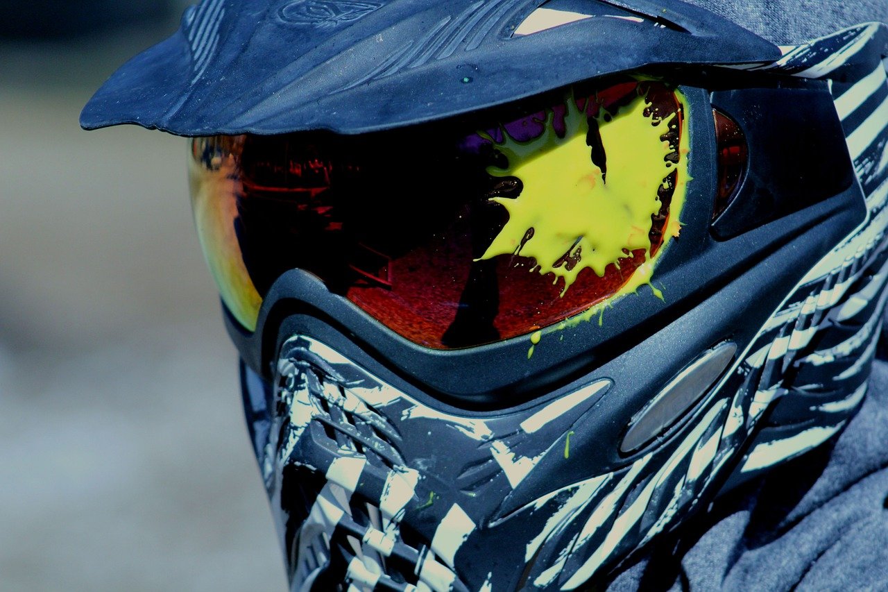 Paint splash shown on mask of a paintball player