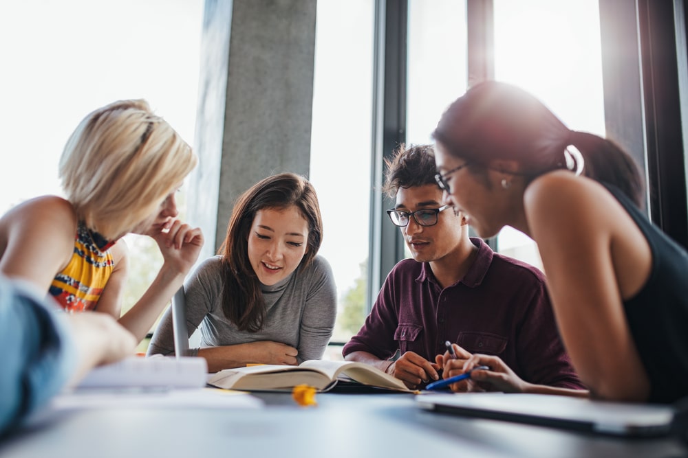 Group of university students working on a case study