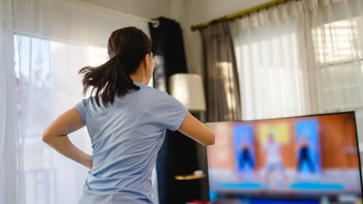 Woman doing a Beachbody workout at home