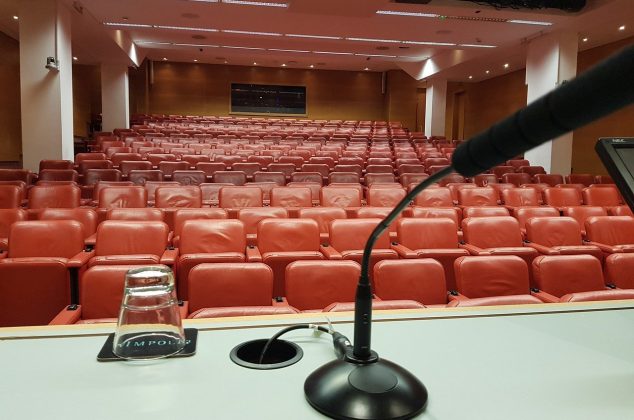 Microphone set up on in an auditorium for a debate team event
