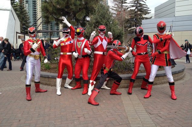 Superhero team wearing red costumes