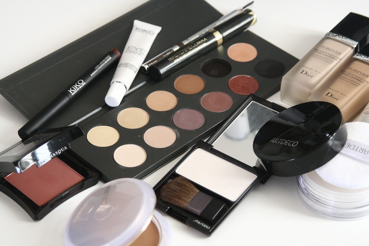 Assortment of beauty products resting on a white table