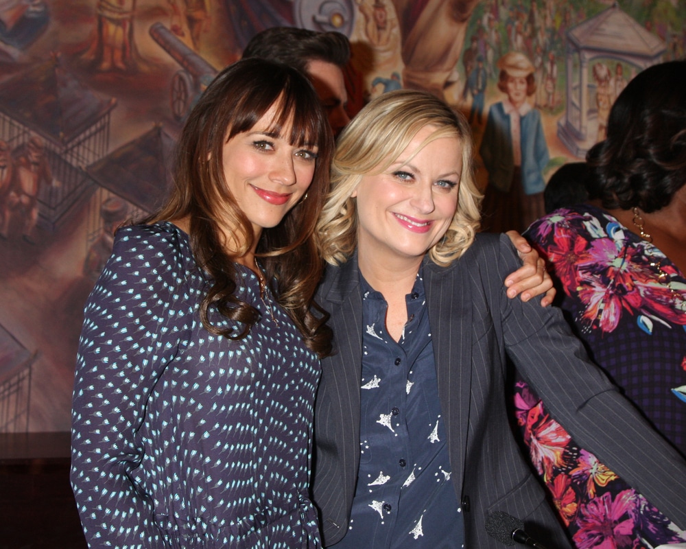 Parks and Rec cast members Rashida Jones and Amy Poehler at an event