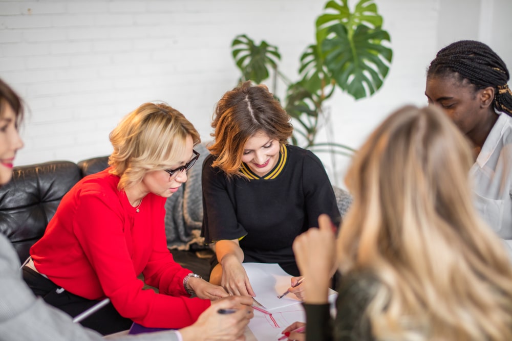 Team of Pure Romance consultants discussing their business