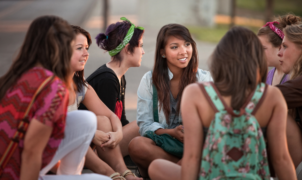 Youth group having a discussion outdoors