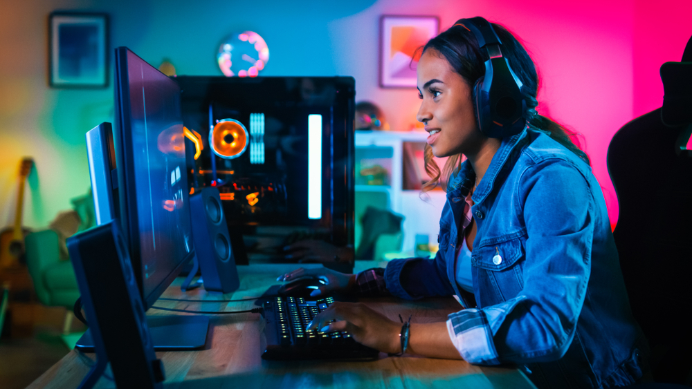 Woman playing Black Desert on a gaming PC