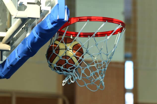 Basketball entering the net at a pro-am game